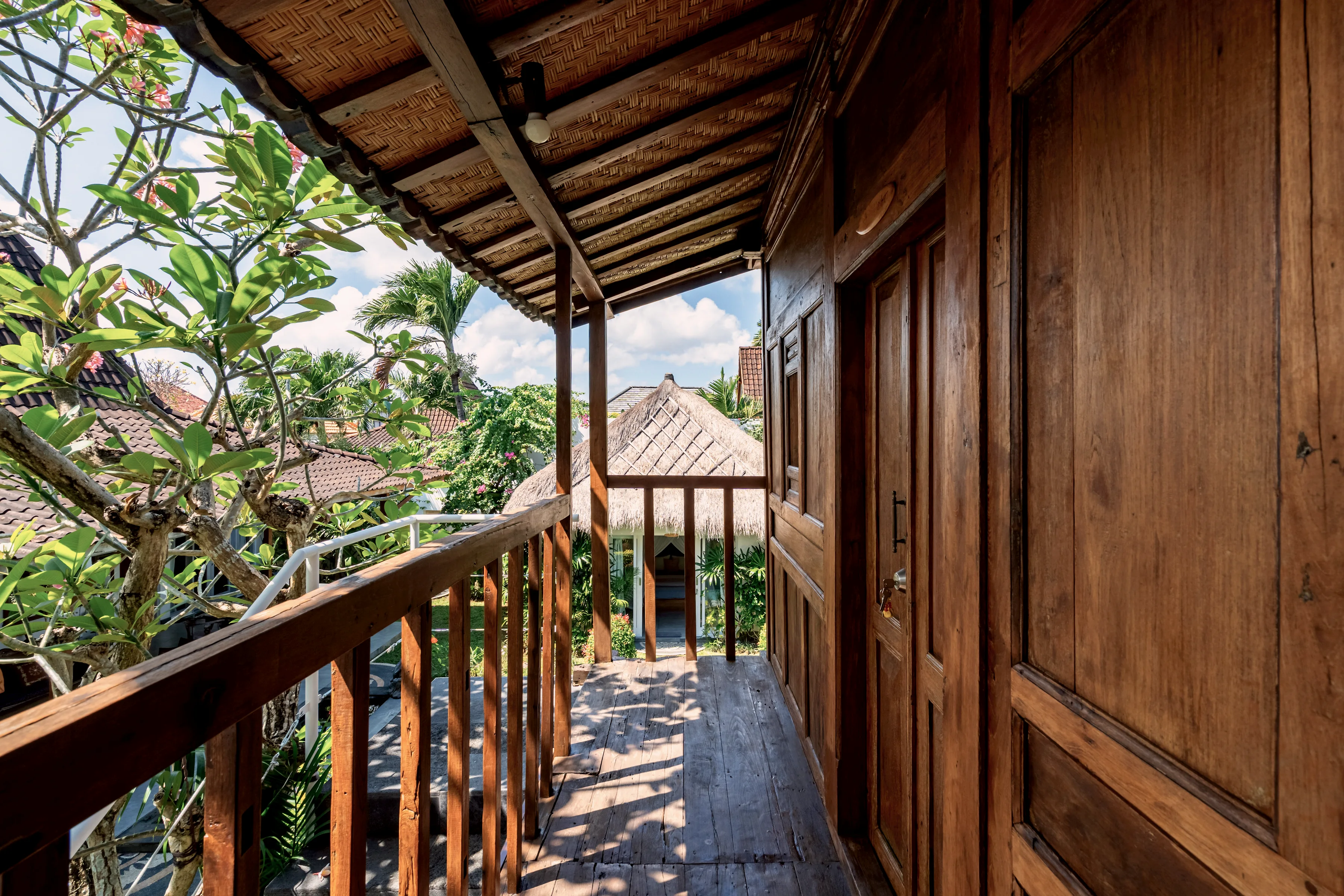 The Joglo bedroom’s teak balcony over the garden