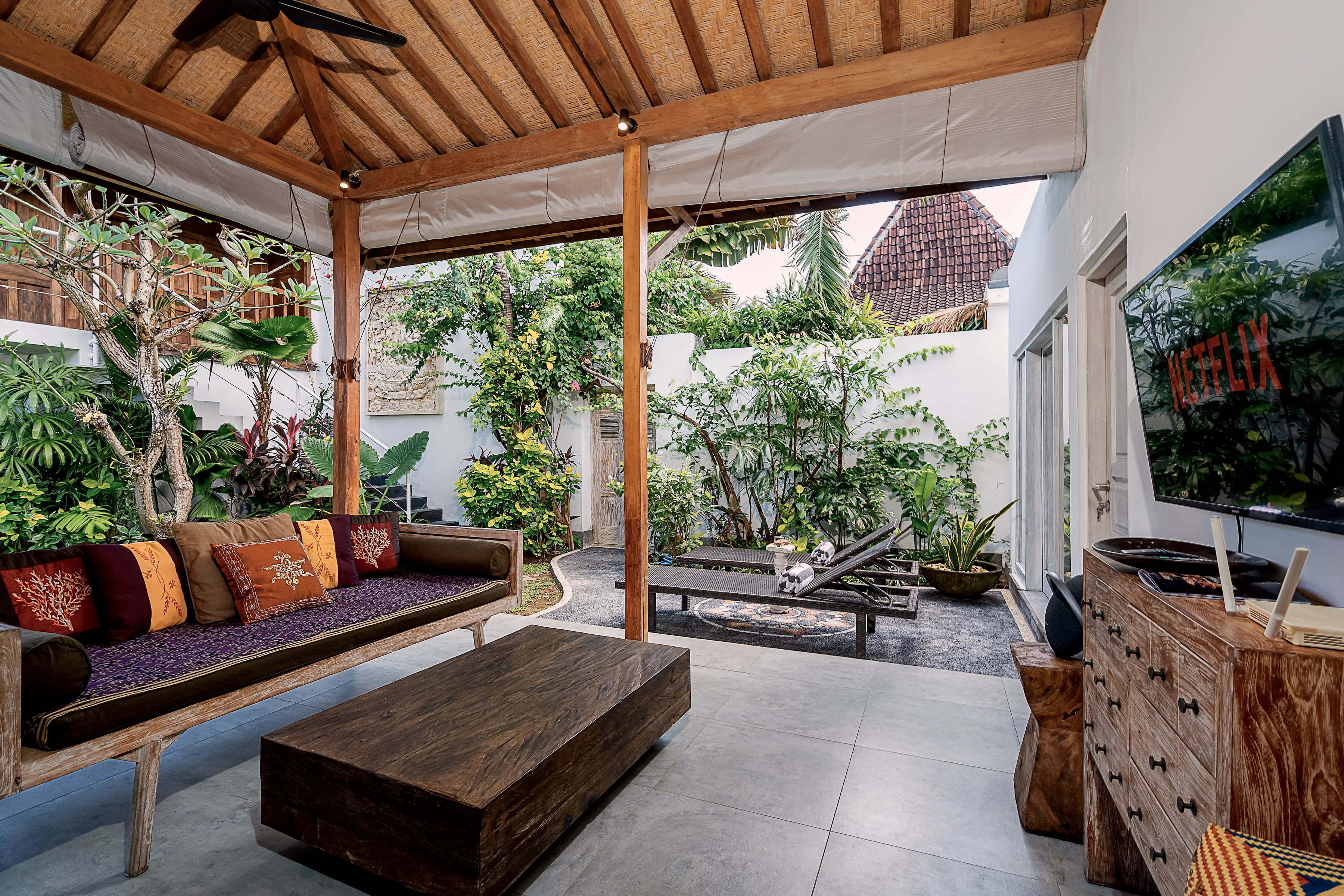 The lounge open to the garden on one side